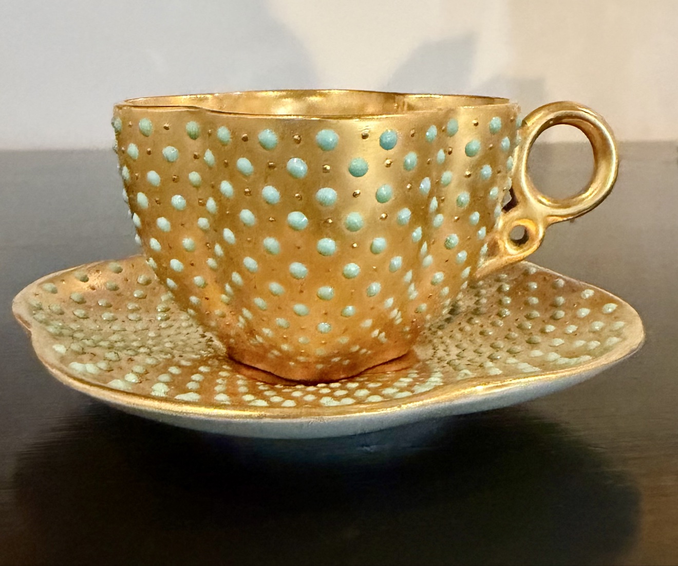 Gold demitasse cup and saucer with turquoise jewelling